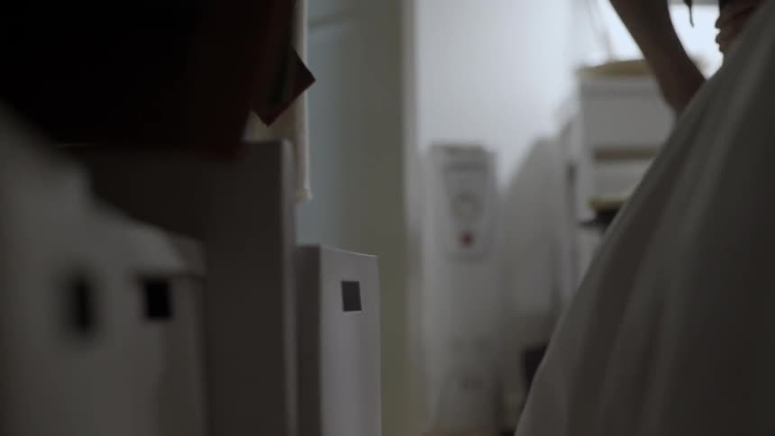 A person looks through boxes