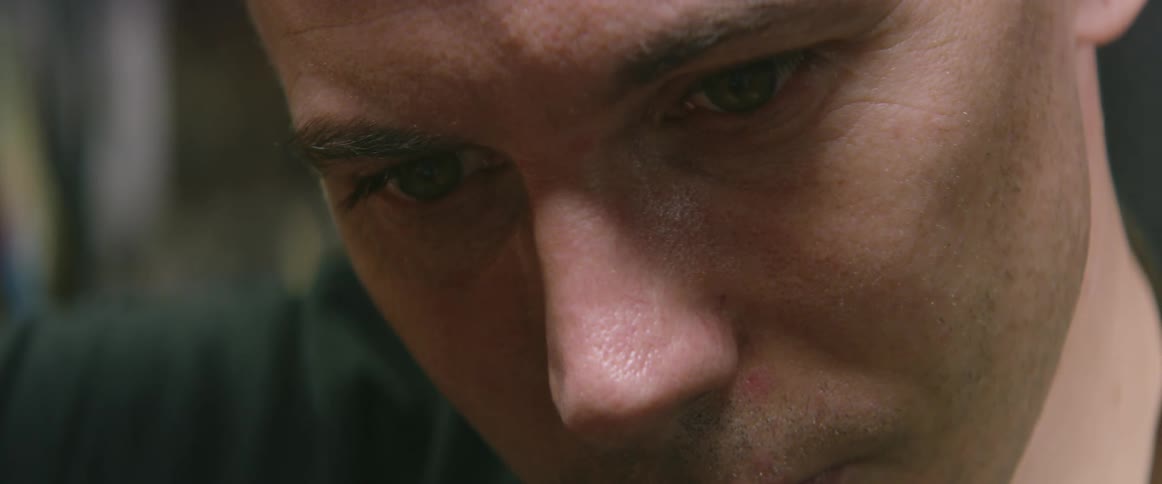 A craftsman stares intently while working