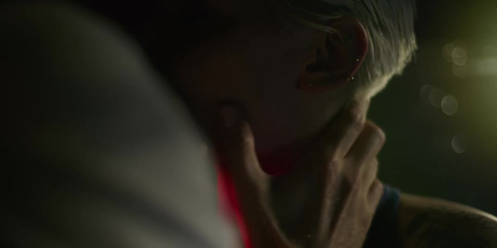 Man and woman kissing at night