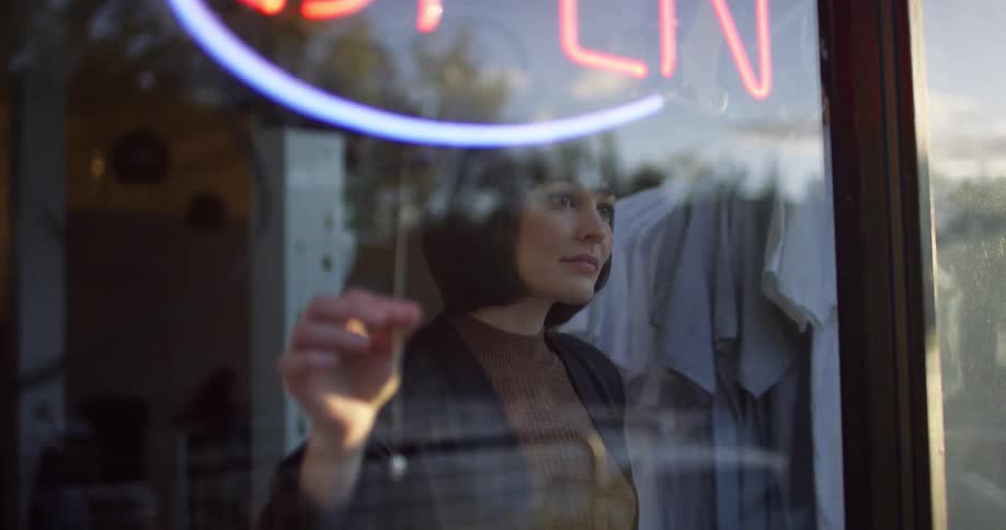 Store owner ready to close the business for the day