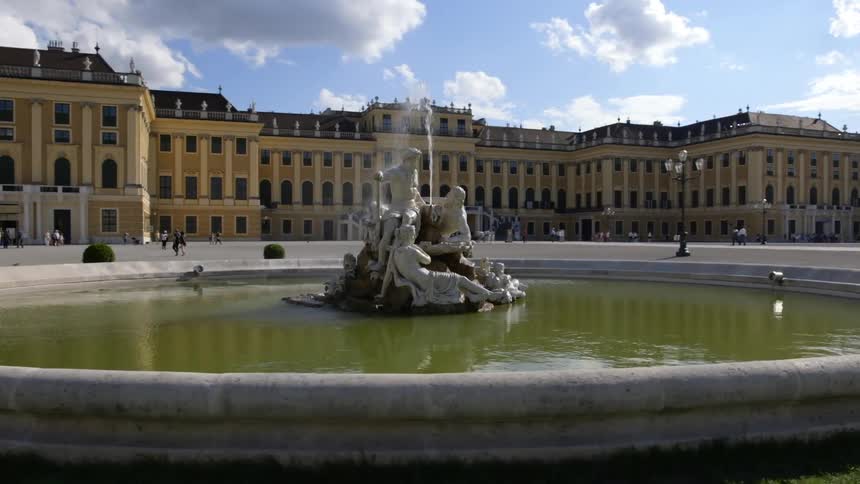 The water sprays over the statues in the fountain