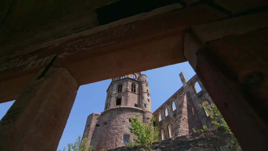 Walking out of a tunnel and into a castle courtyard