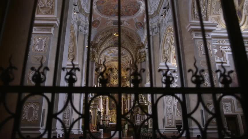 Pews fill a large area of a cathedral