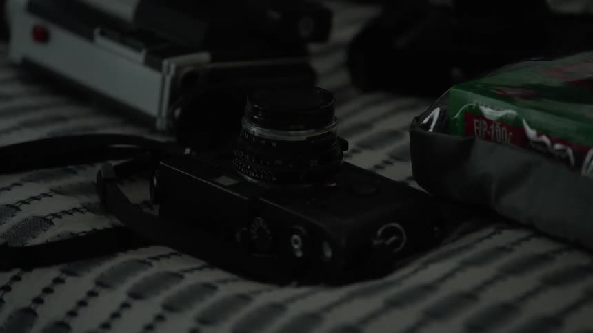 Cameras laying on bed