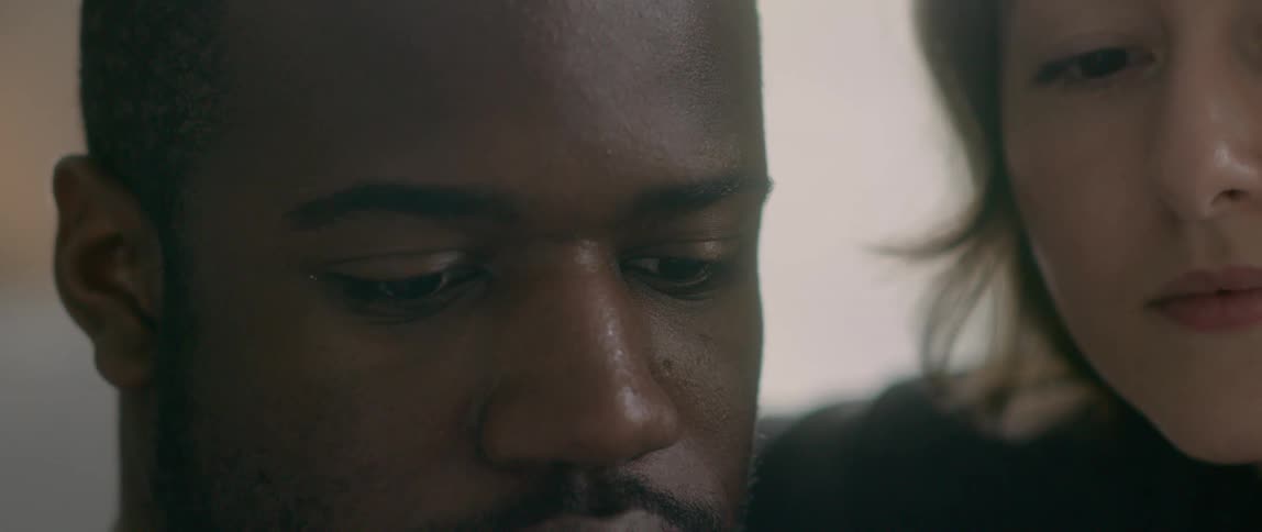 A man and woman cuddle together
