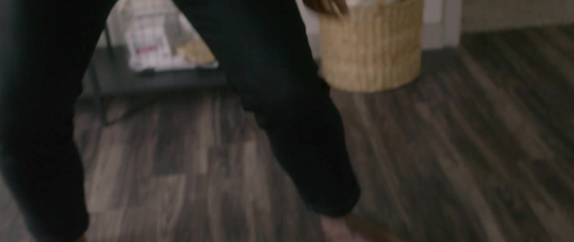 A man is dancing on laminate flooring