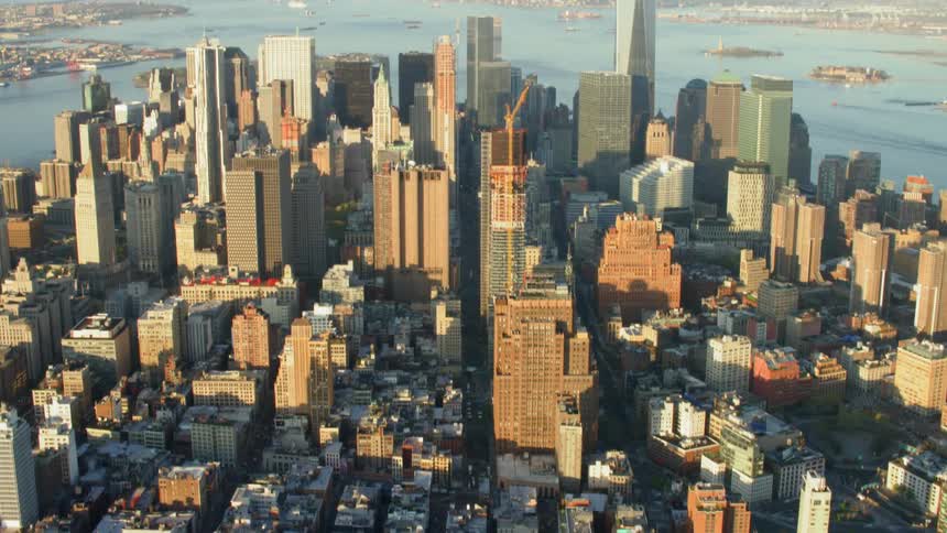 Water surrounds the city of large buildings