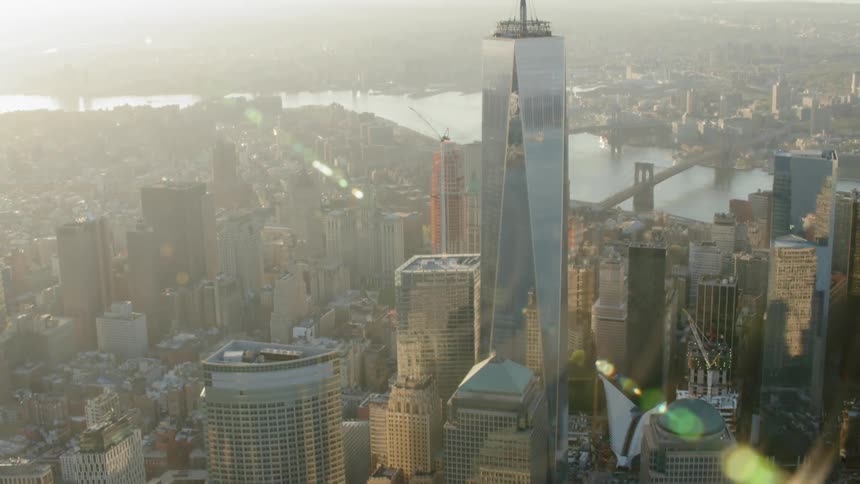 One world trade center and new york city at dawn