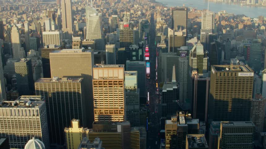 A river runs through a city filled with skyscrapers