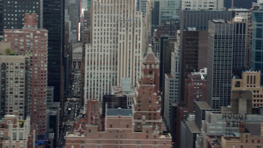 Traffic moves along busy streets between skyscrapers downtown