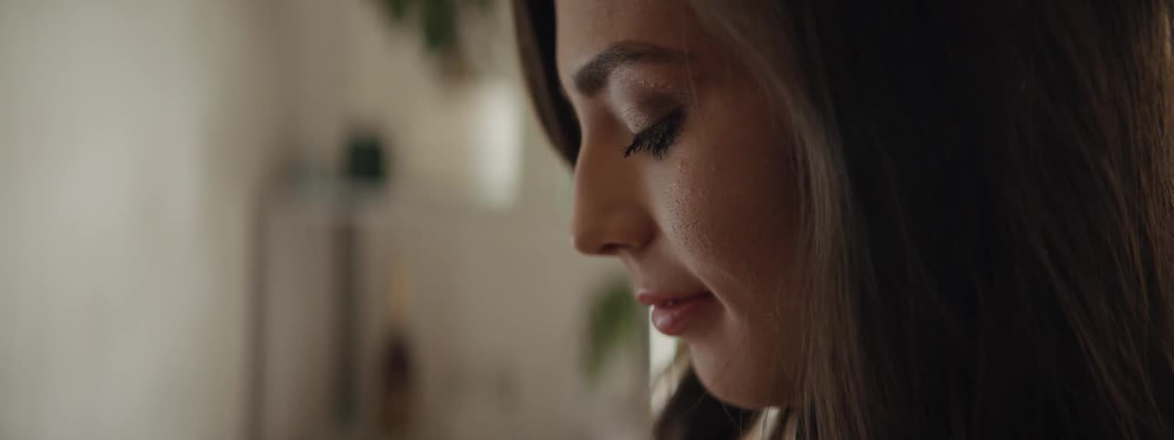 A woman is looking down