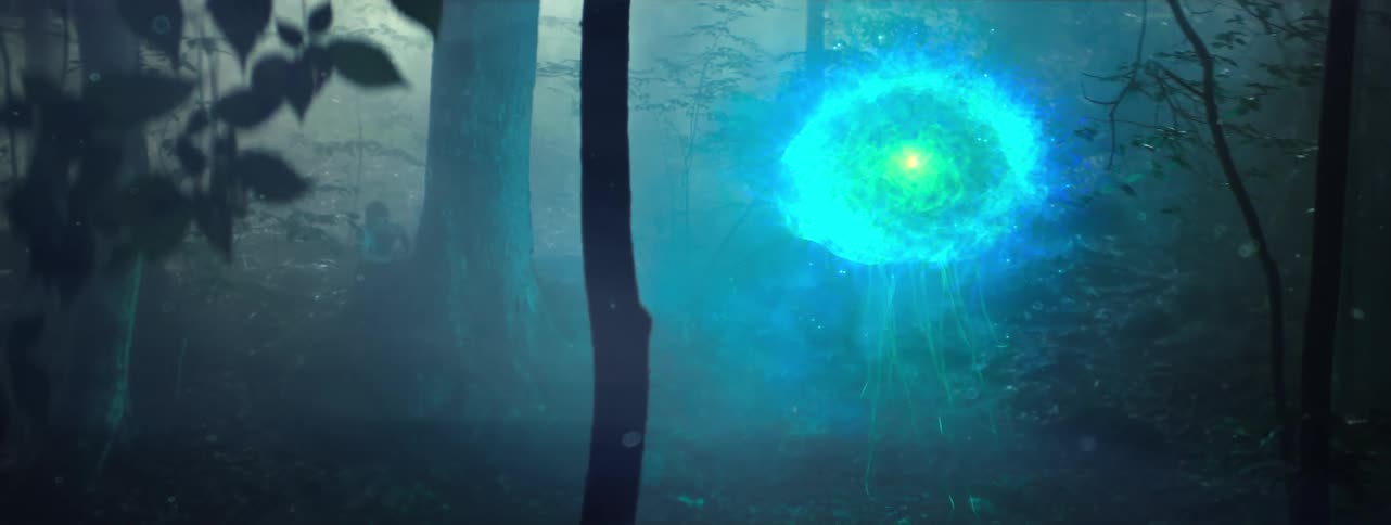 A glowing creature floats in the woods