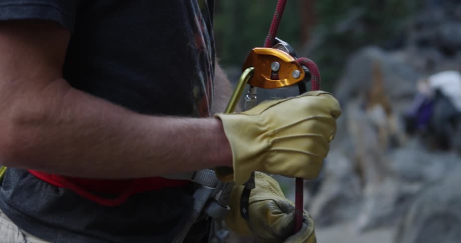 A man pulls the rope on his harness
