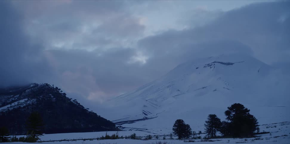 Clouds covering a mountain range in timelapse