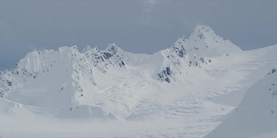 Time lapse of clouds moving over a mountain top