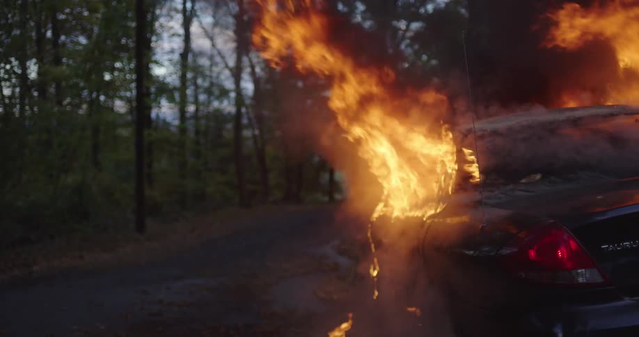 The car is engulfed in flames