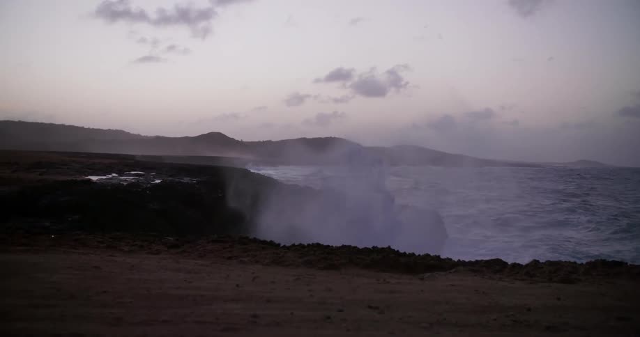 The waves crash against the shore