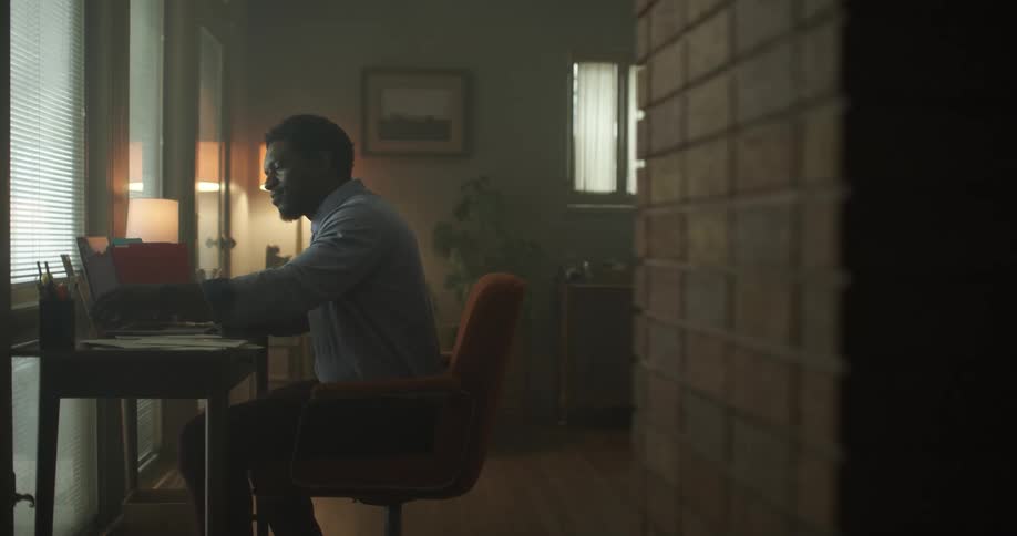 A man is working in his office