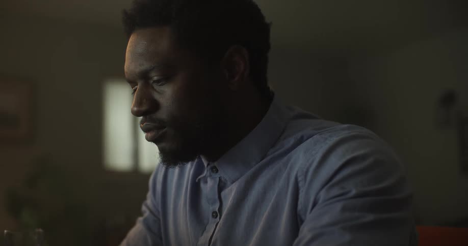 A man looks at something and concentrates
