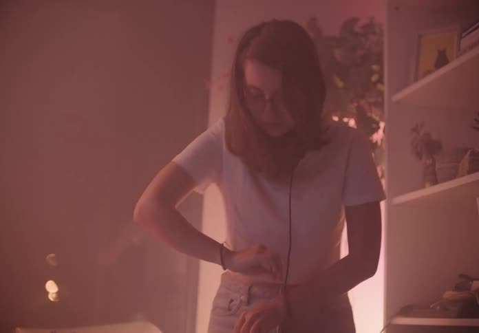 A girl is playing music in a venue