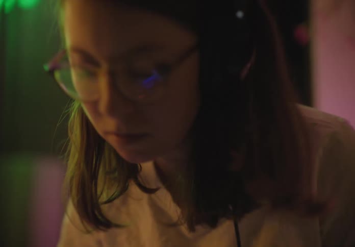A girl is playing instruments in a venue