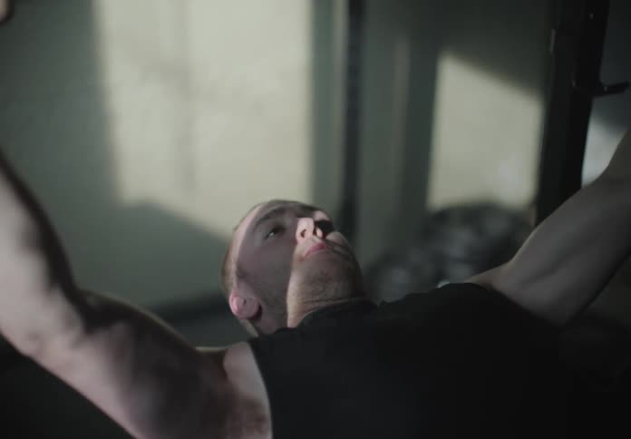 A man bench presses