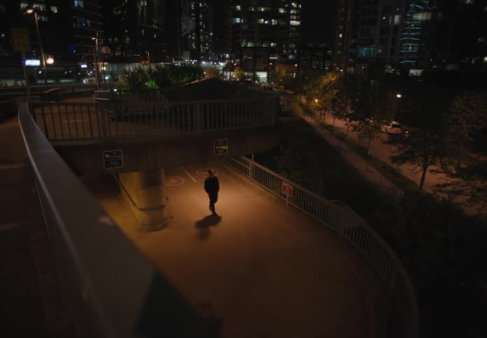 A pedestrian is walking in a city