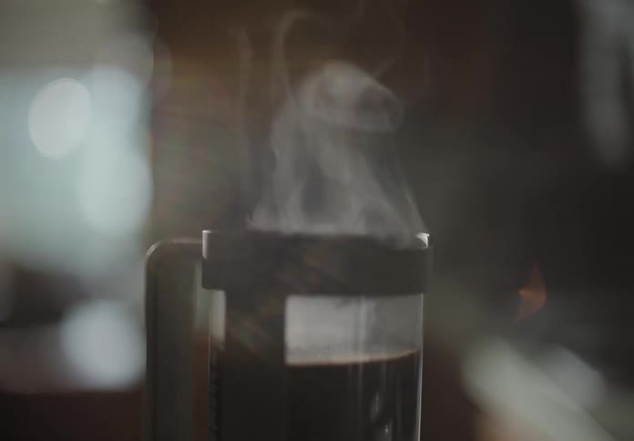 A steaming cup of coffee