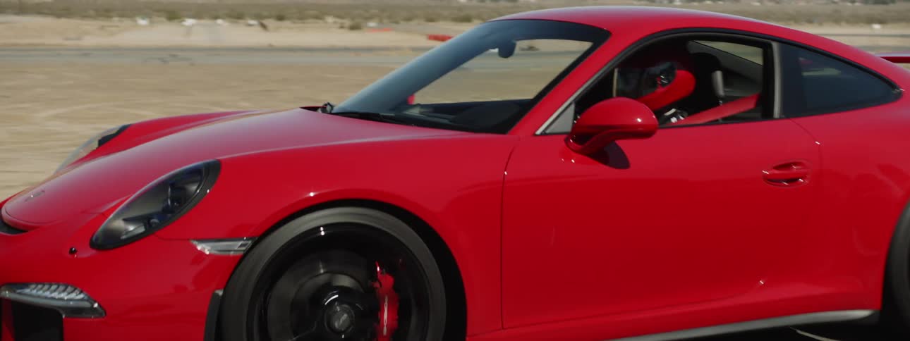 A man drives his car on a track