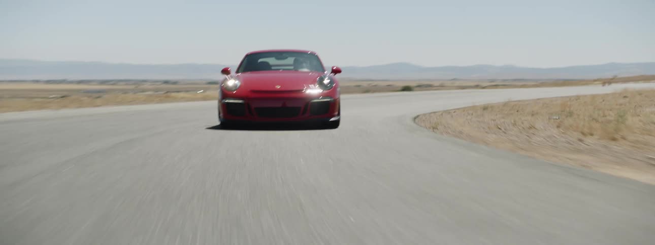 A person races their car on a road