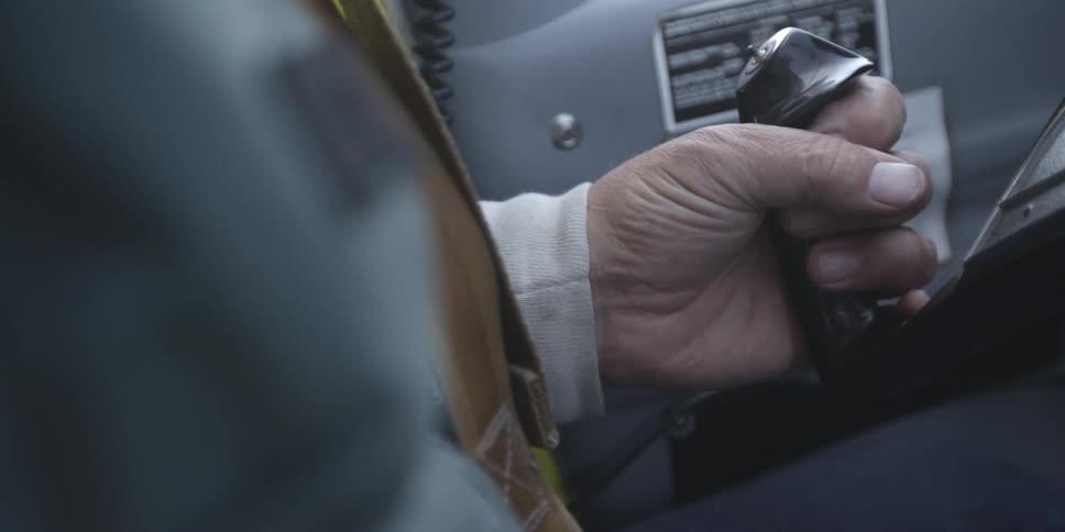 A person clutches a controller