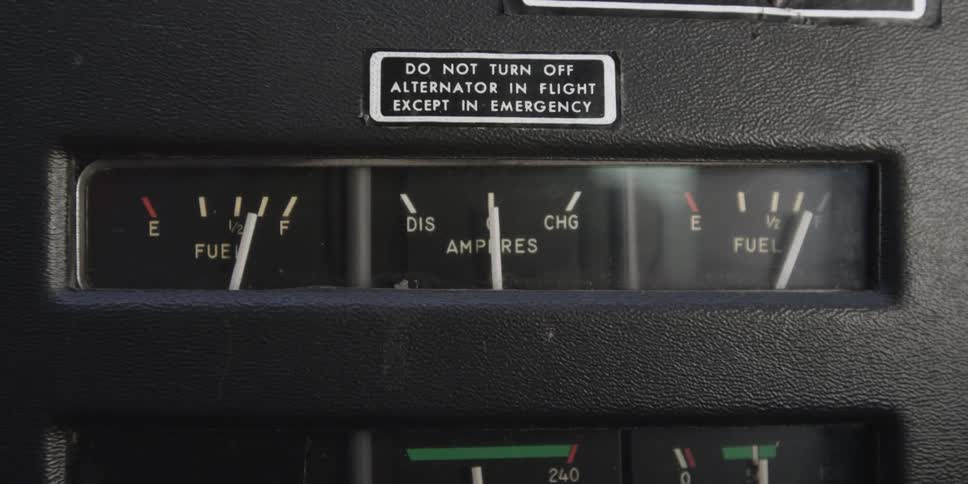 Needles of instrument gauges indicating an airplane's fuel status