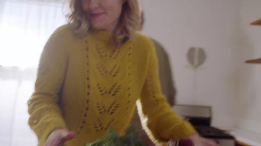 Couple preparing a meal together in their kitchen