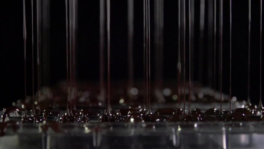 Liquid is being poured from a machine