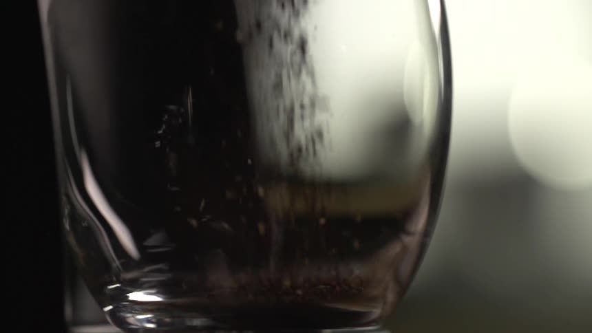Instant coffee being poured in a glass