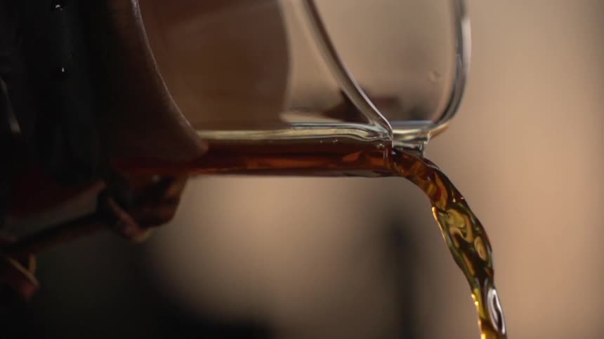 A beverage being poured in a studio for a photo shoot