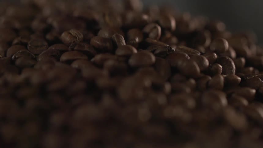 Coffee beans landing in pile