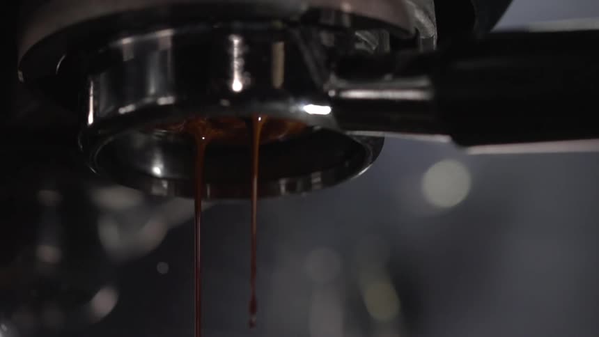 Chocolate drips from a machine used to make coffee drinks