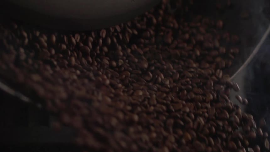 Coffee beans in a roaster in a factory
