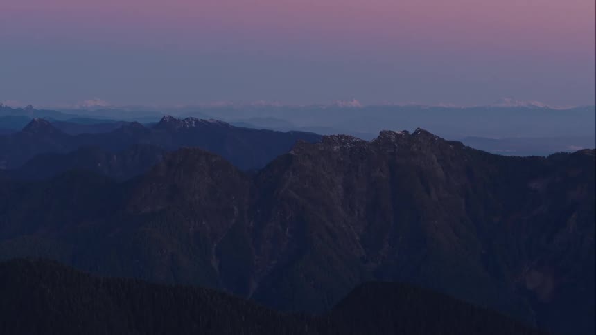 A mountain ridge with the sky in the background