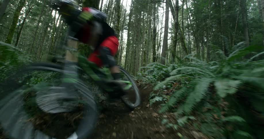 A man is biking downhill