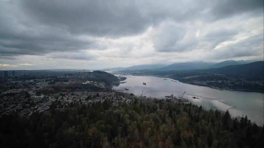 A distance aerial of Vancouver skyline with inlet