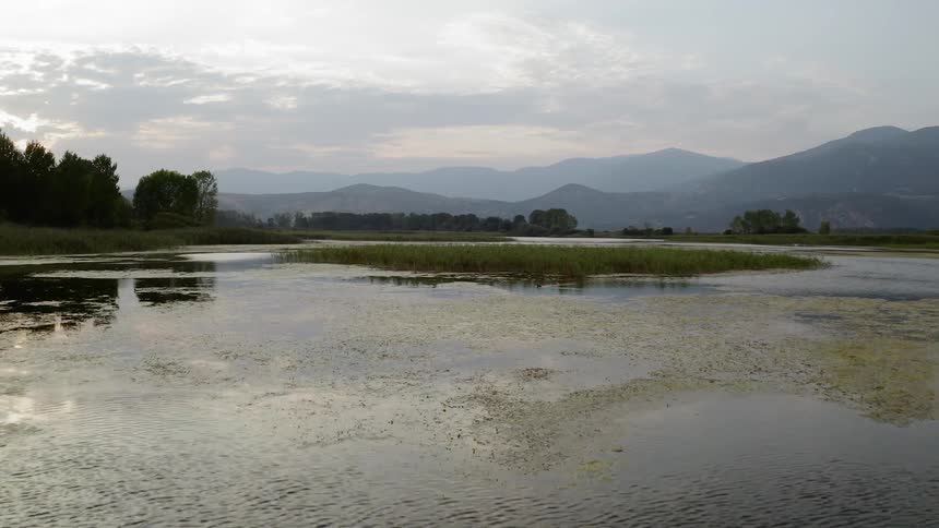 Large lake in front of mountain range