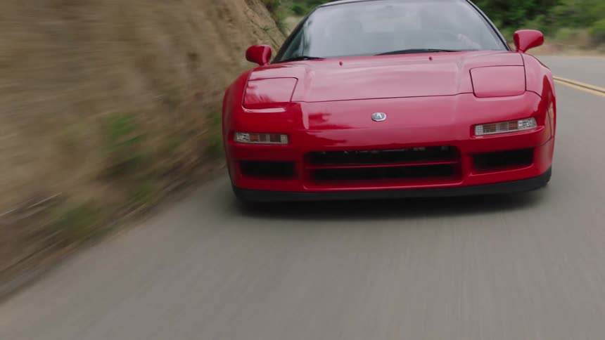 A car is driving down a highway outdoors