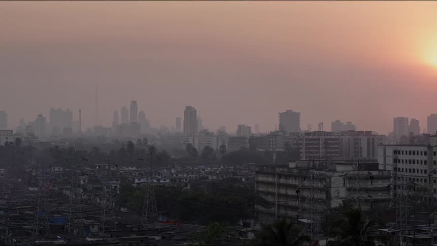The sun above a city skyline