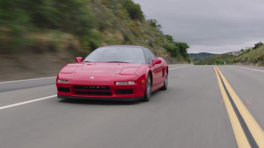 A car drives down a highway