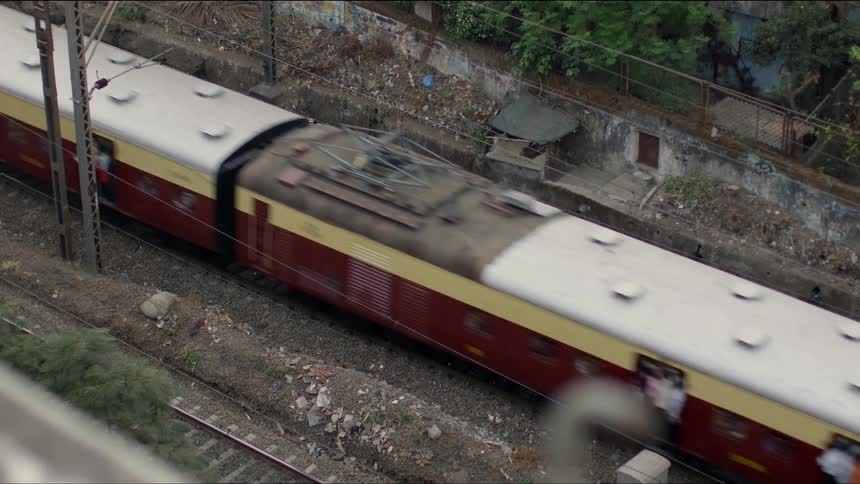 A train running by a track