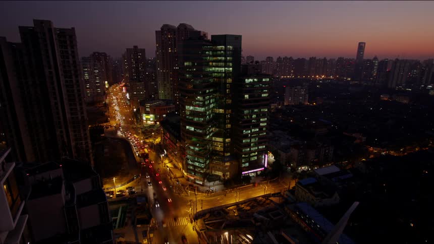 Flow of traffic on busy city street at night