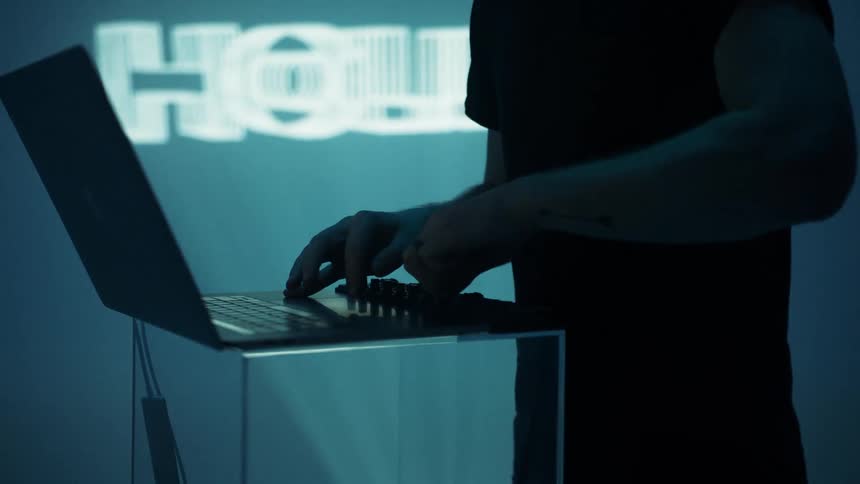 A man djing on a laptop