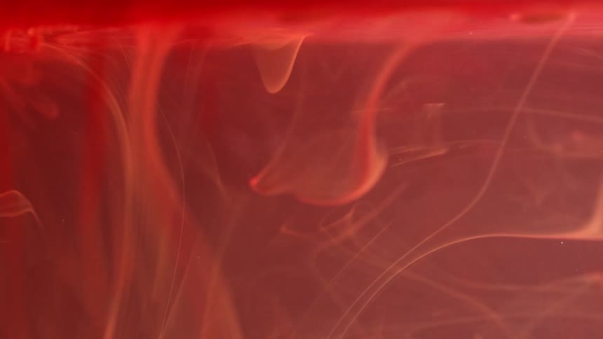 Orange smoke swirling in abstract patterns